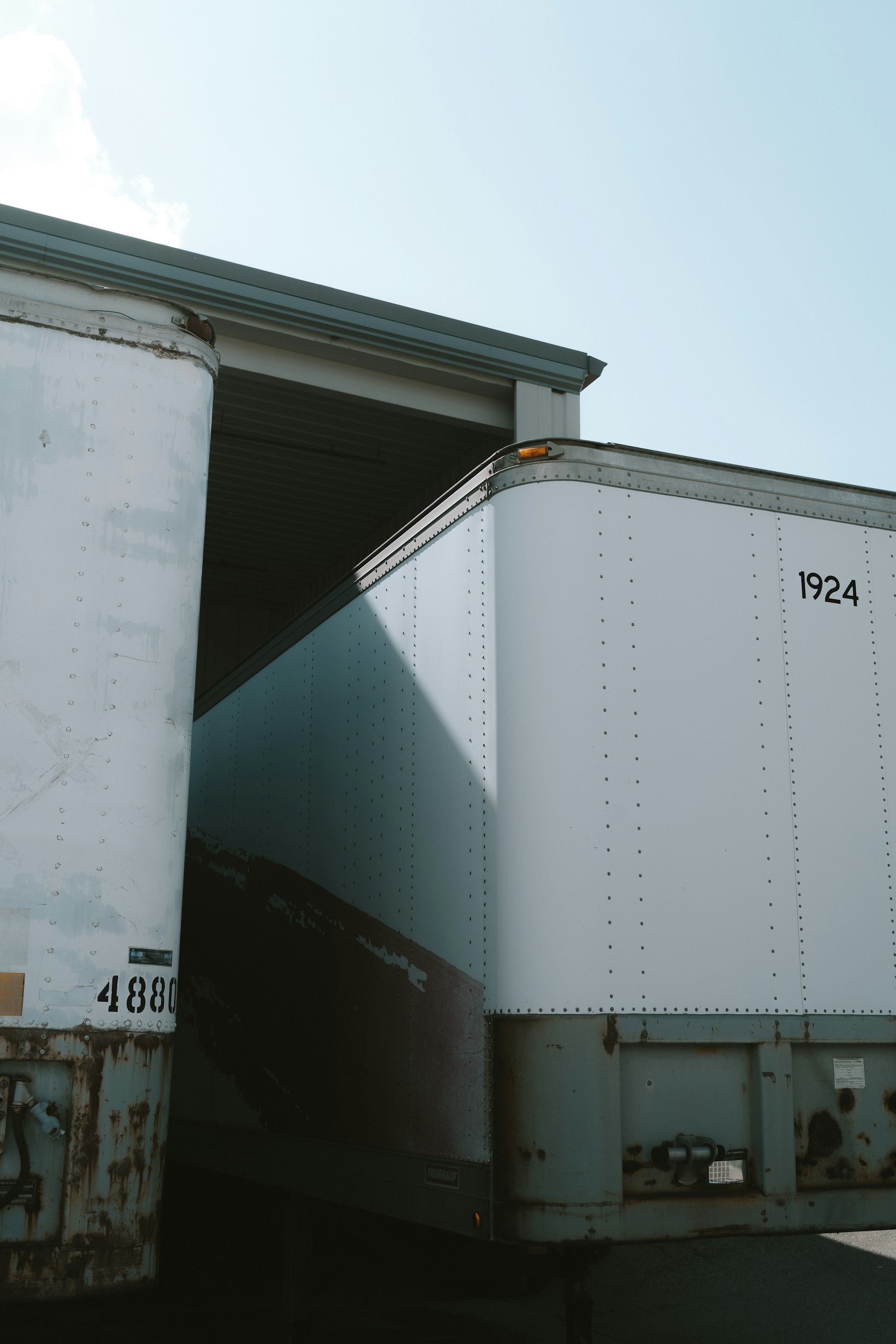 Trailers beside a working facility